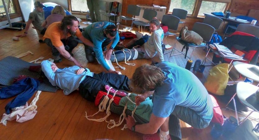 People work on bracing legs as part of a WFR class. 